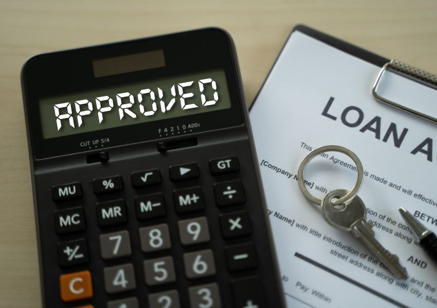 a%20calculator%20with%20the%20word%20approved%20on%20it%20next%20to%20a%20mortgage%20loan